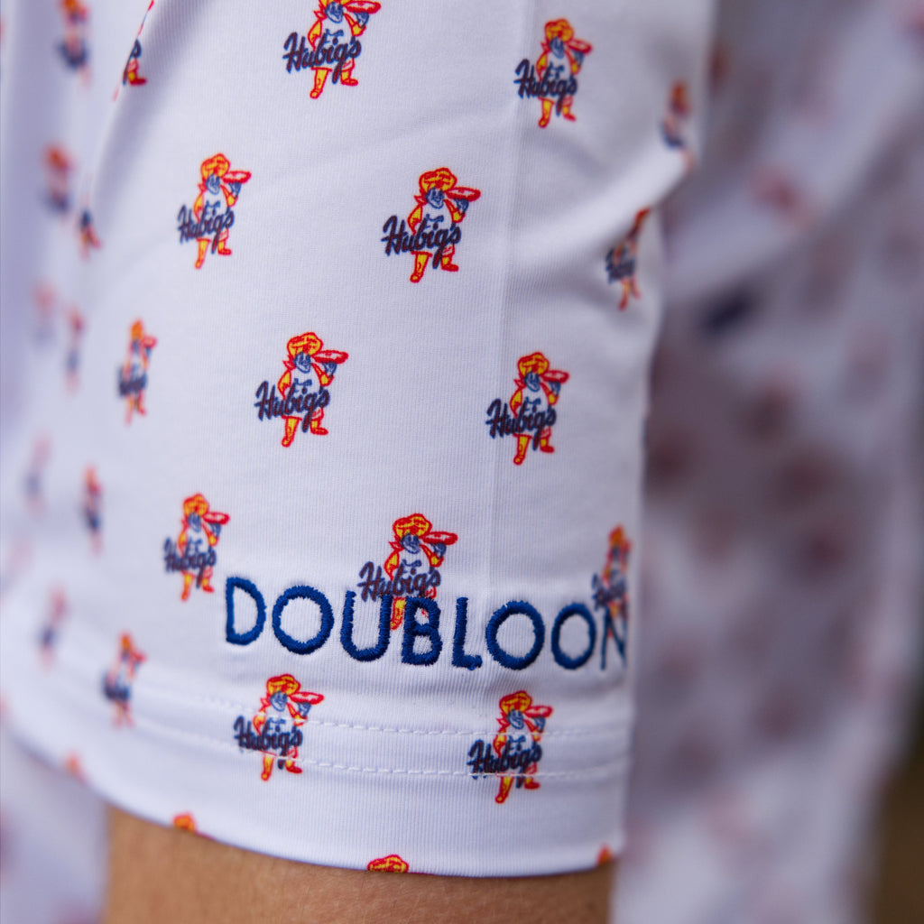 White polo shirt with mini Savory Simon Hubig's logos and shirt brand name DOUBLOON on left sleeve. 