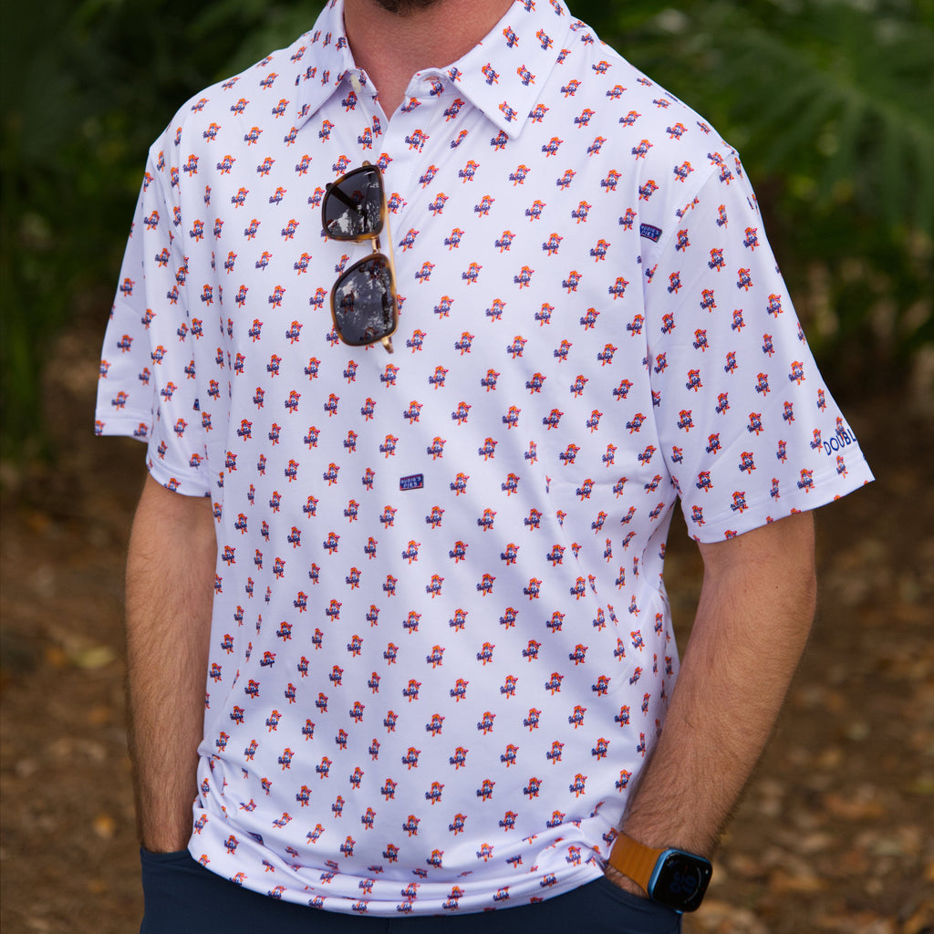 Man wearing a white polo shirt with mini Hubig's Savory Simon logos and shirt brand name DOUBLOON on left sleeve. 