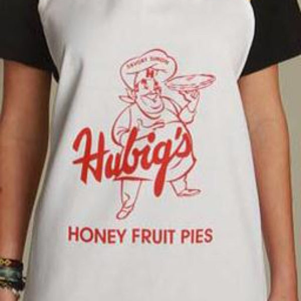 Person wearing a white apron with Hubig's Honey Fruit Pies logo